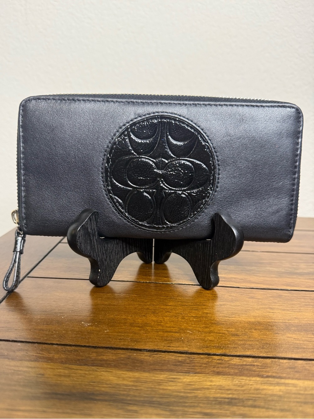 Coach wallet. Black leather with patent leather accent